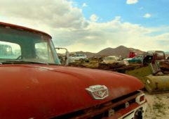 899323289-car-wrecks-car-repair-station-junk-yard-mojave-desert